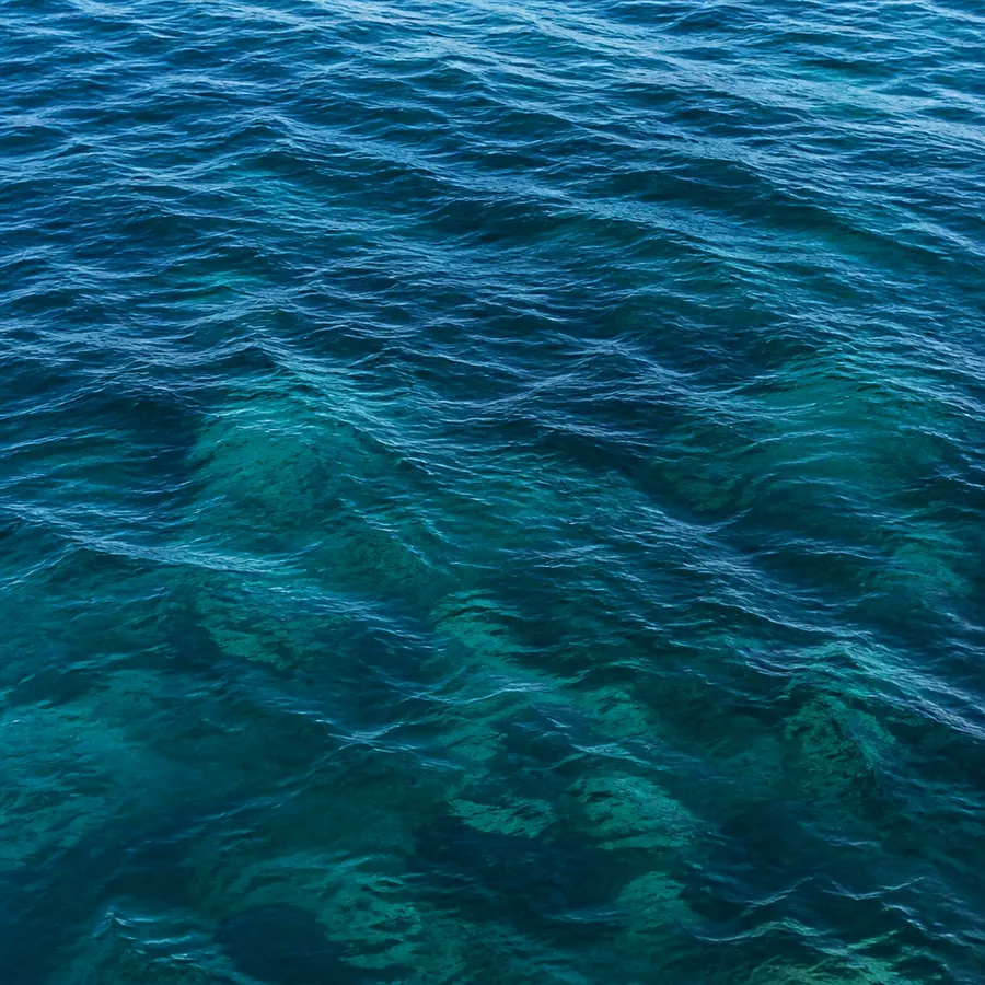 Aerial view of calm teal ocean waves